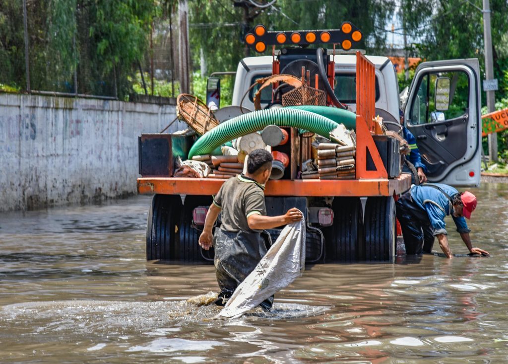 Professional water extraction machine removing water from flooded property