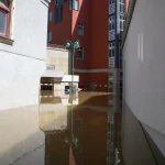 Dark flooded basement interior requiring emergency water extraction services